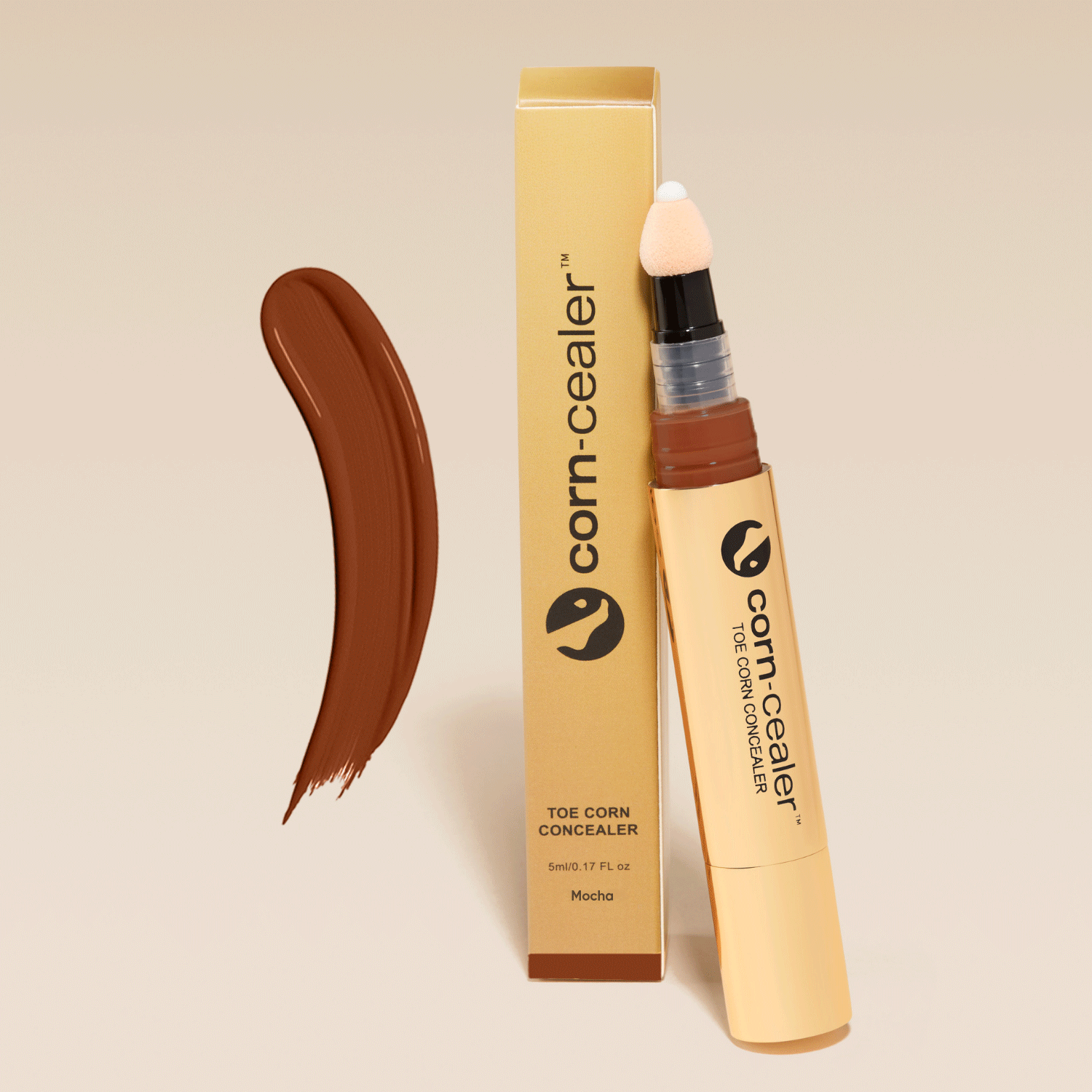 Toe Corn Concealer in Mocha shade with applicator and packaging. Provides flawless, water-resistant coverage for toe corns, perfect for open-toed shoes.