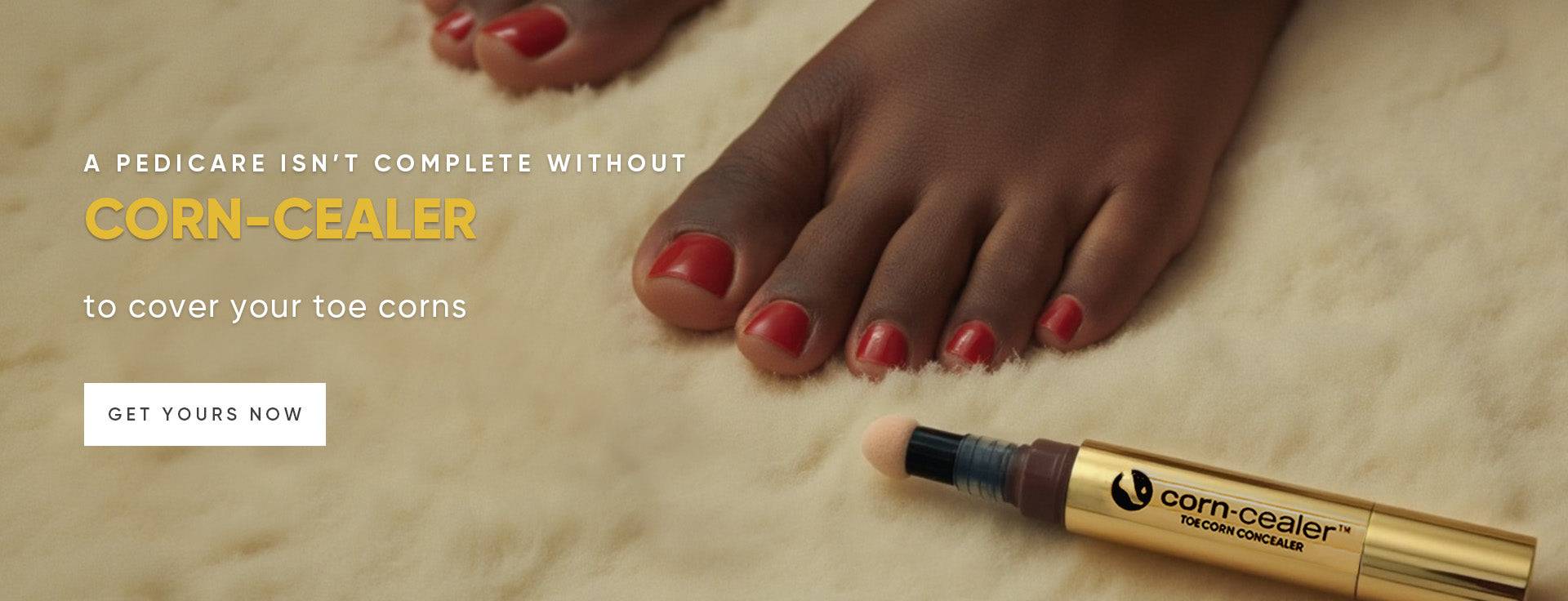 Close up of black woman's toes with corns covered after using Corn-Cealer Toe Corn Makeup, with a Corn-Cealer pen beside her foot. Image text reads: "A PEDICURE ISN'T COMPLETE WITHOUT CORN-CEALER to cover your toe corns"